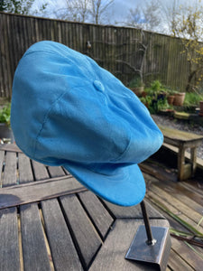 baby blue velvet baker boy cap on hat stand