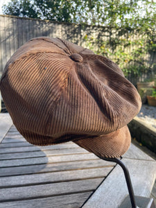 caramel brown corduroy baker boy hat on hat stand