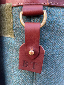 embossed leather name tag on tweed garden tool belt